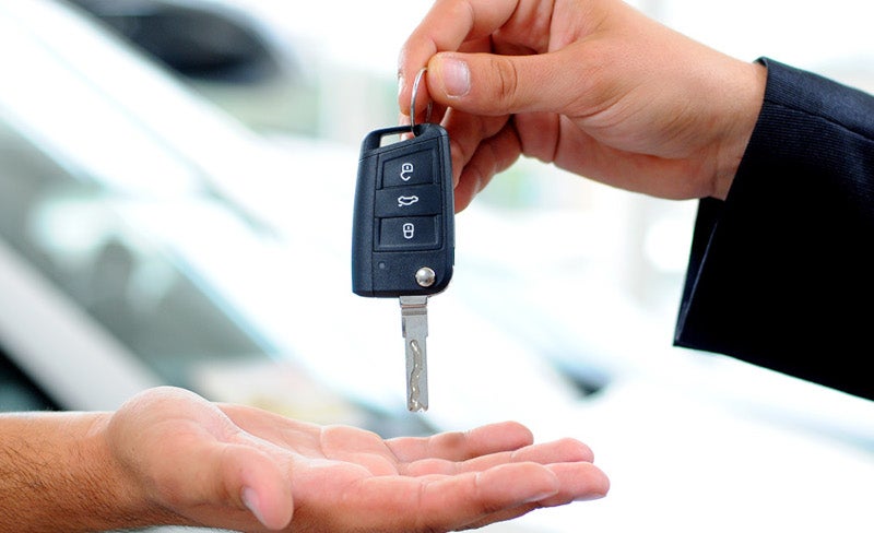 two people exchanging car key